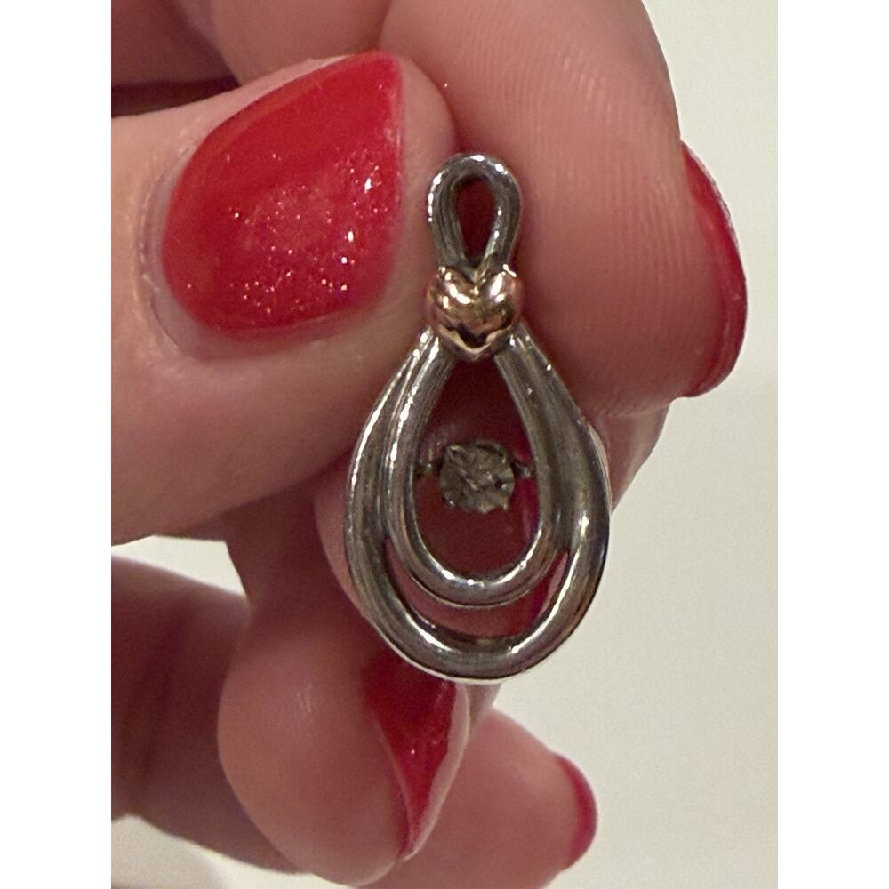 925 10k Sterling Silver Floating Diamond In Motion Pendant